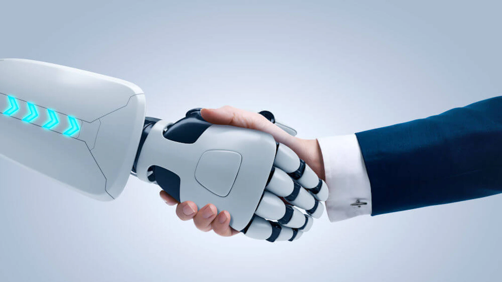 Robotarm schudt hand van man