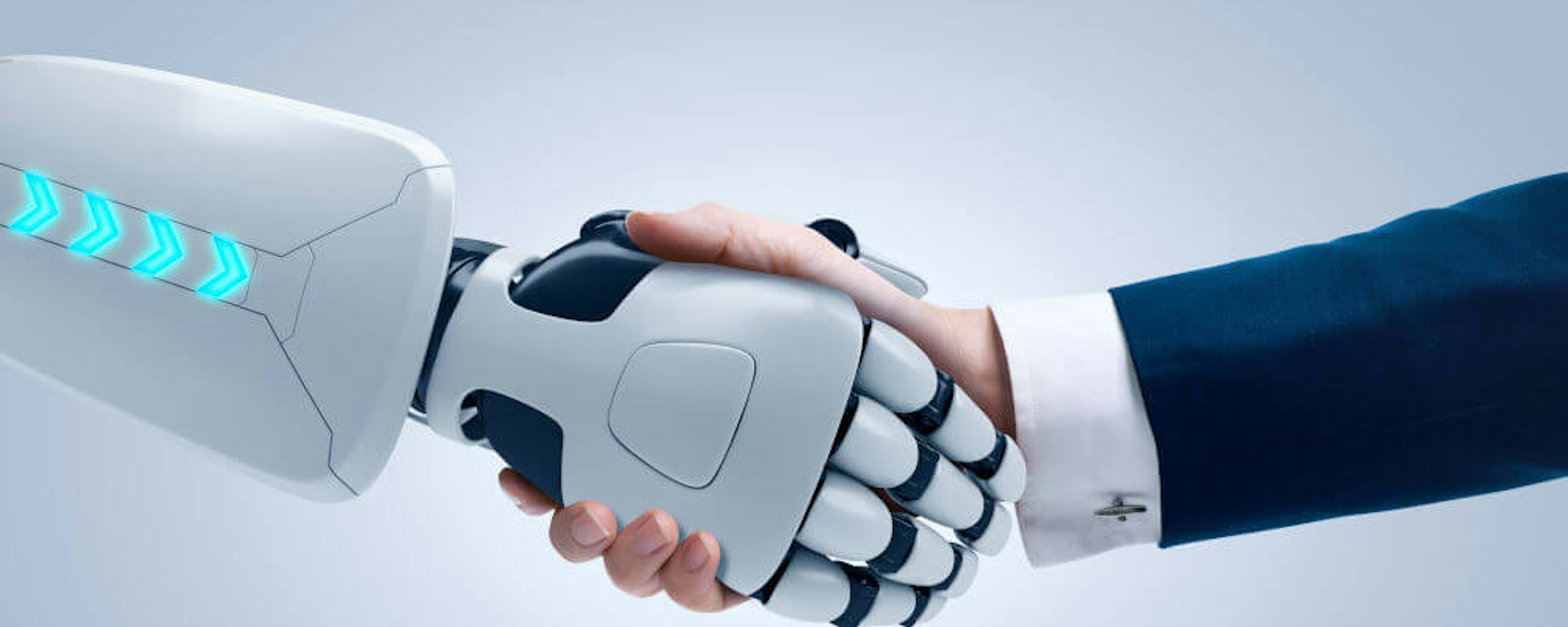 Robotarm schudt hand van man