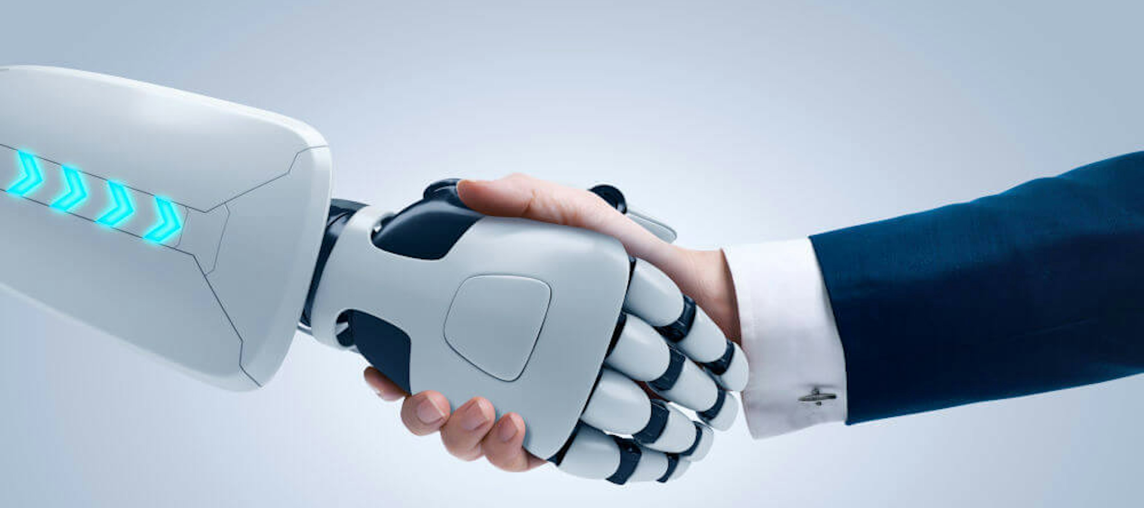 Robotarm schudt hand van man